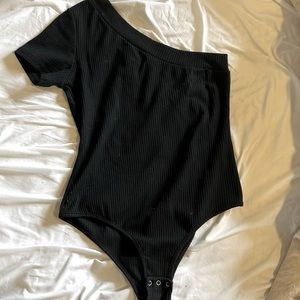 One shoulder body suit. Ribbed fabric with snap bottom
